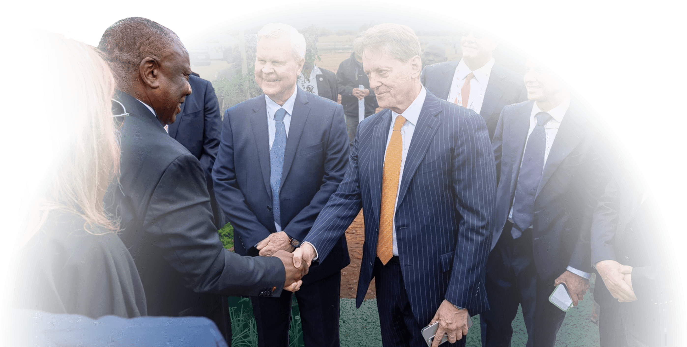 Cyril Ramaphosa shaking hands with Bill Hayden and Robert Friedland